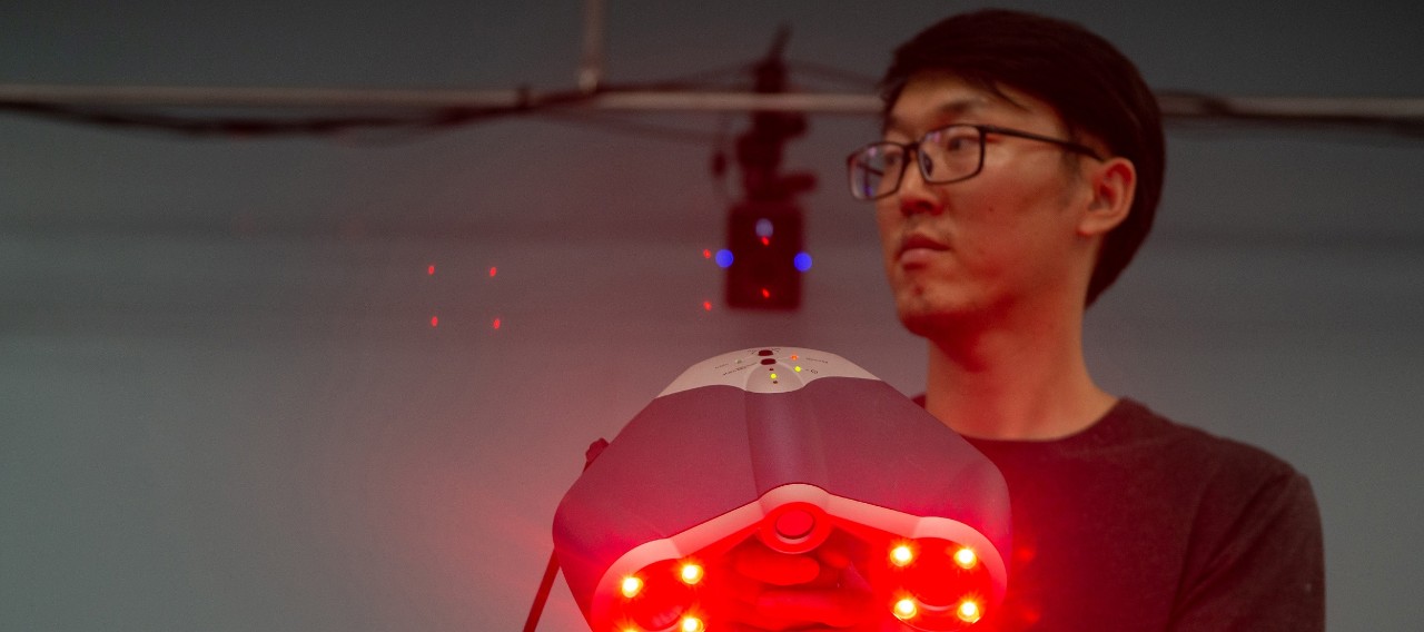 Student in lab using device