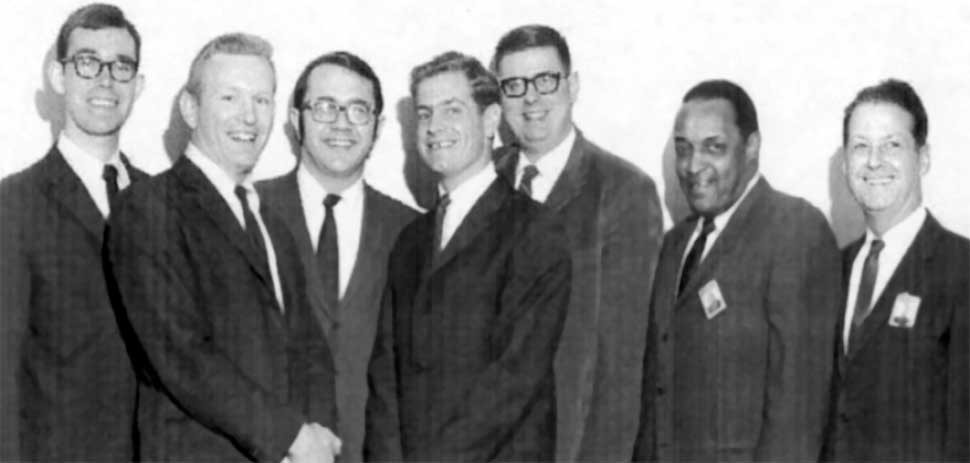 First GE-AE/UC graduates, 1969. L to R: David Amos; George Grant; Stav Perdumo, AC Supervisor; Bud Thomas; Bob Kraft; John Blanton, GE AE Program Manager; unknown.