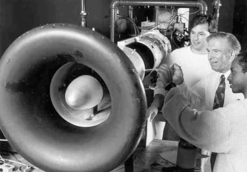 Dr. Tabakoff with graduate students at the jet engine test facility