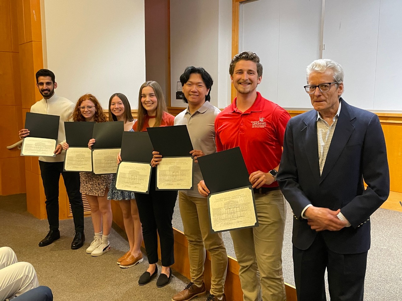 students holding certificates