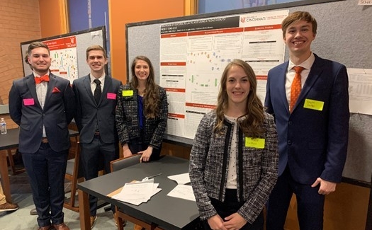 Students pose at the capstone presentation event