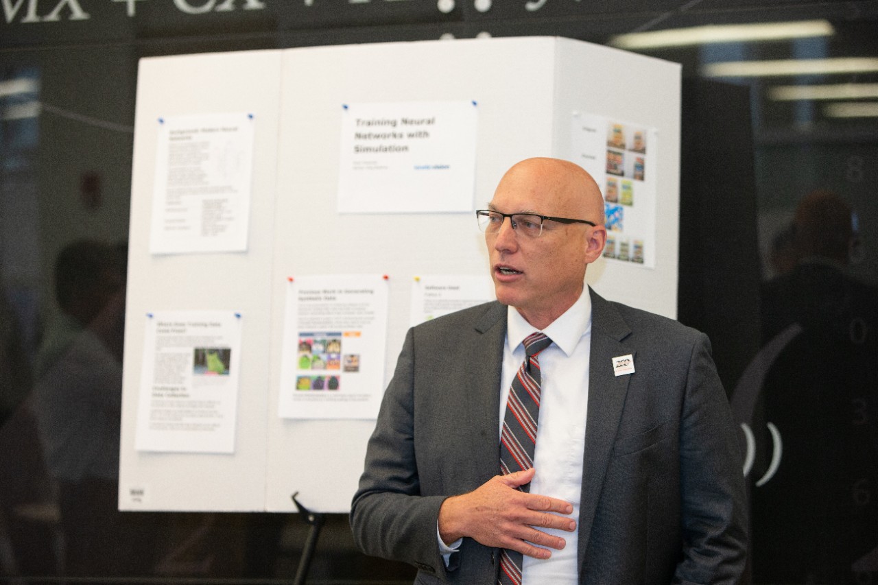 Summer Protégé Engineering students showcase their work at a poster session.