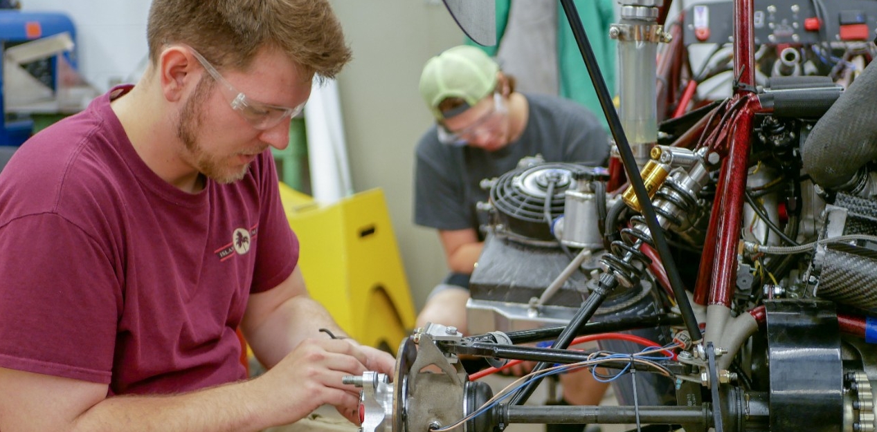 Students working on Bearcat Motorsports parts