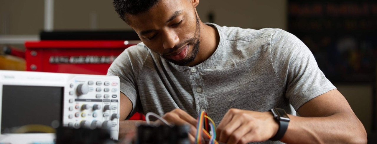 Technology, Lab
Students pose in CEAS Professor Zach Fuchs's lab, where he uses pinball mechatronics to demonstrate principles of electrical engineering.