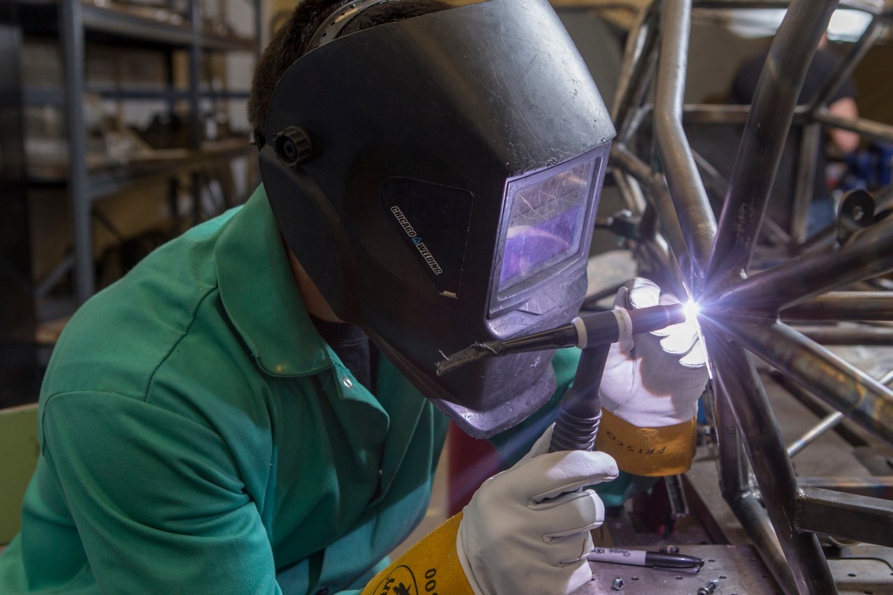 CEAS Photo shoot in the Mechanical Engineering Bearcat Motorsports Professor Randy Allemang & Student Captain Jacob Frisco with UC students at ERC. UC/Joseph Fuqua II
